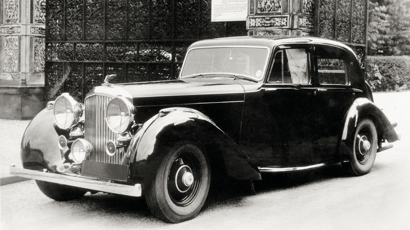 Side angled view of 4.25 Litre Derby Bentley, black exterior featuring halogen lamps and vertical vaned radiator