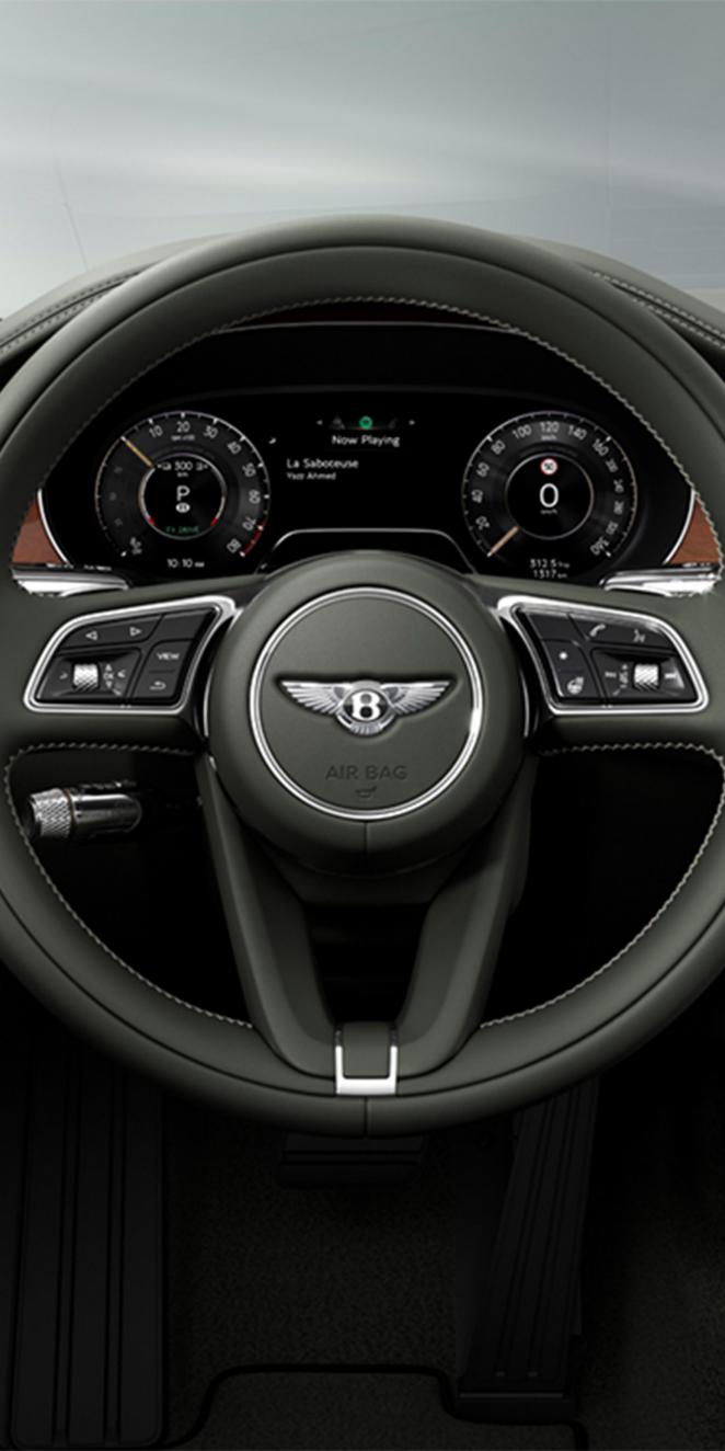 Close up of the steering wheel in the new Bentley Continental GTC featuring Beluga main hide