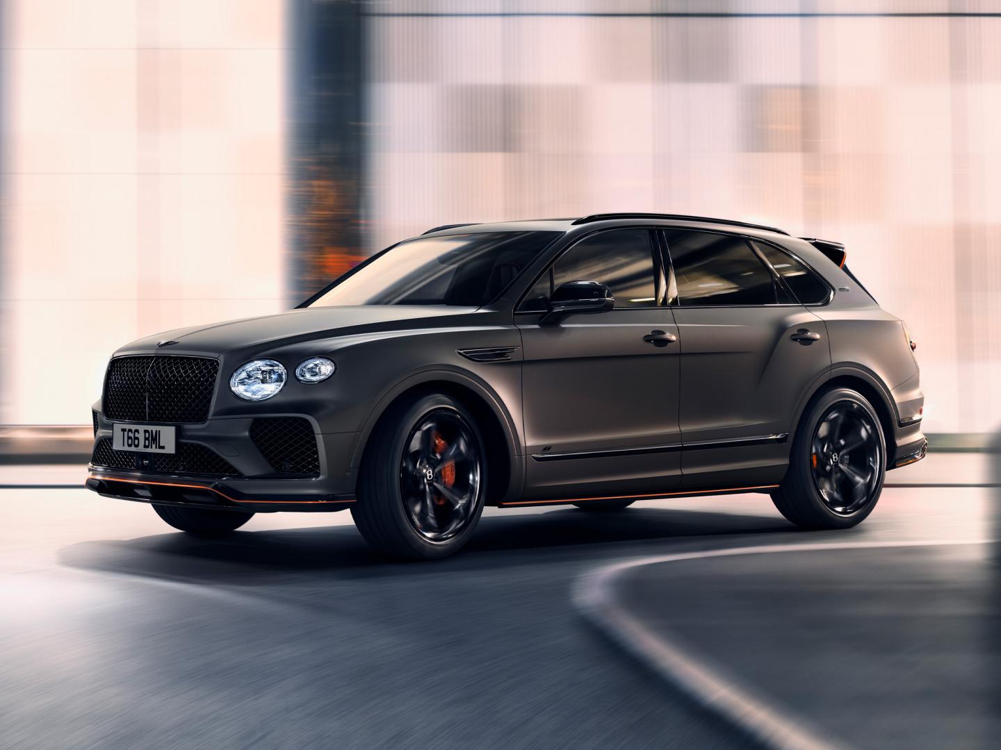 Bentley Bentayga Azure side view in Topaz blue / Kingfisher- by Mulliner colour, featuring 22 inch Painted and Diamond Turned Wheel, driving along sea side.