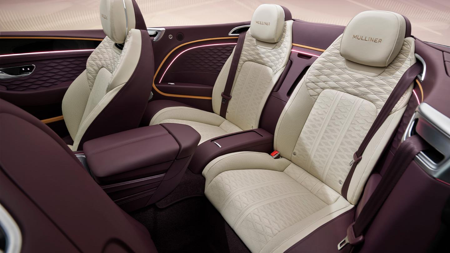 Rear cabin of the new Bentley Continental GTC Mulliner with linen main hide and Damson secondary hide