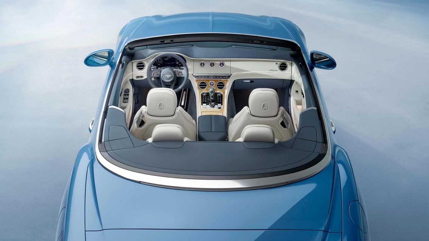 Passenger seat view of Bentley Continental GTC Azure featuring Harmony Diamond Quilt to seats complemented by Portland Hide and Azure Emblems in Imperial blue.