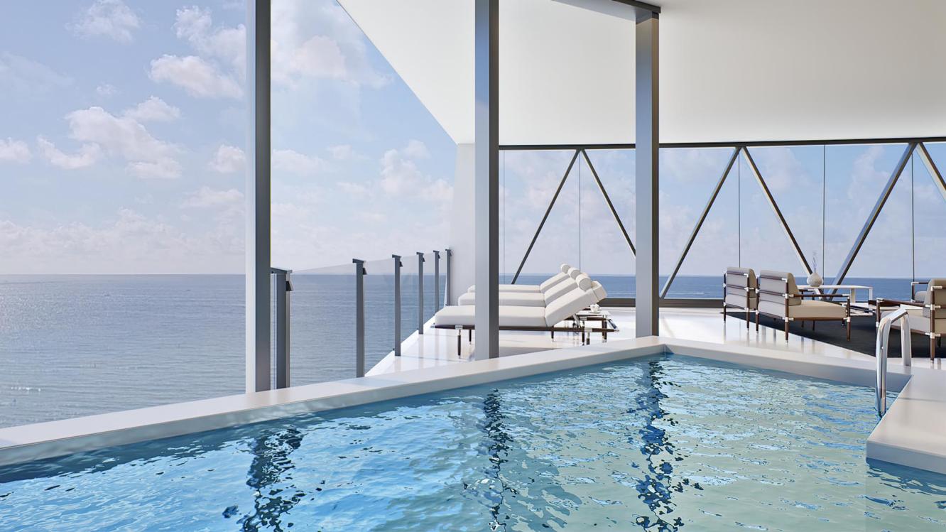 Heated swimming pool in balcony of Bentley Residences Miami , over looking vast stretch of Atlantic ocean.